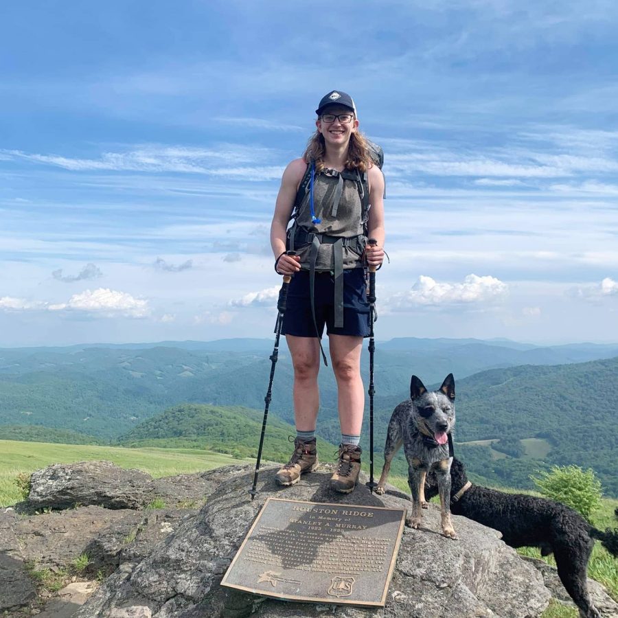 Ms. Thompson atop Wesser Bald with her dog Tucker.
